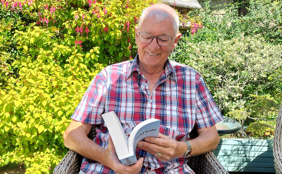 Paul Ludford with his book entitled Imagination